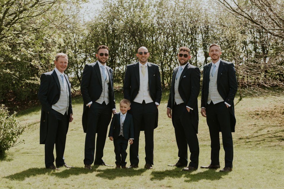 group wedding photograph of groomsmen at the white hard lydgate in saddleworth