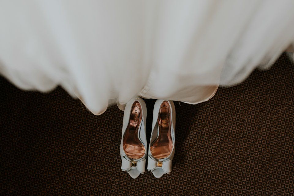 wedding photography photograph of brides shoes on the floor