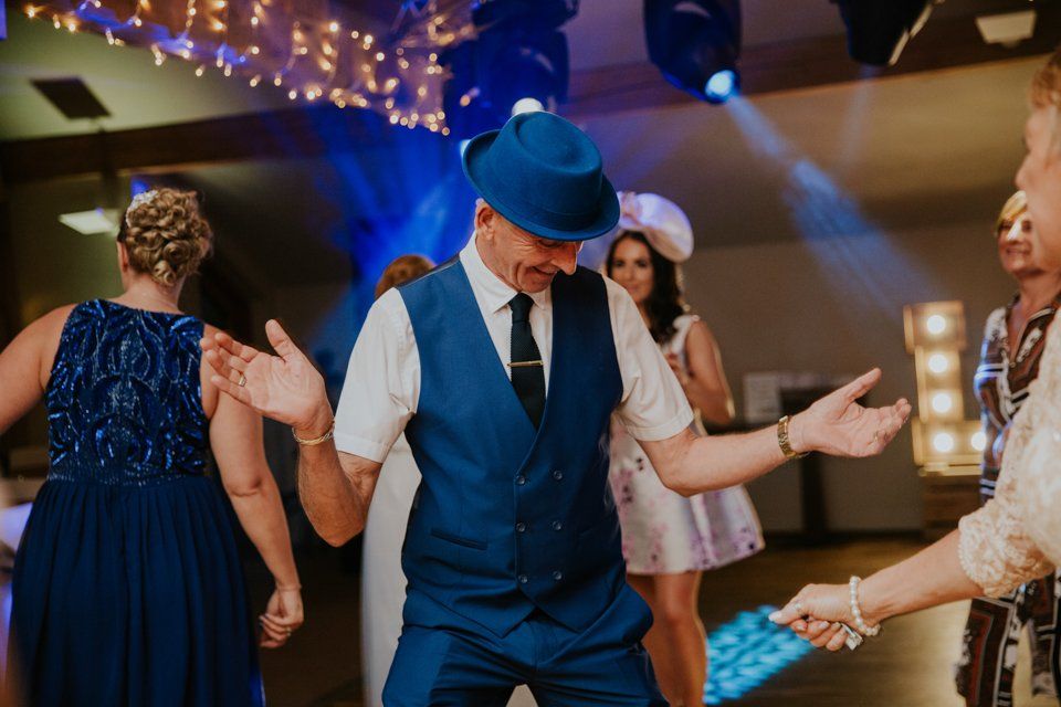 wedding guest dancing at wedding reception 