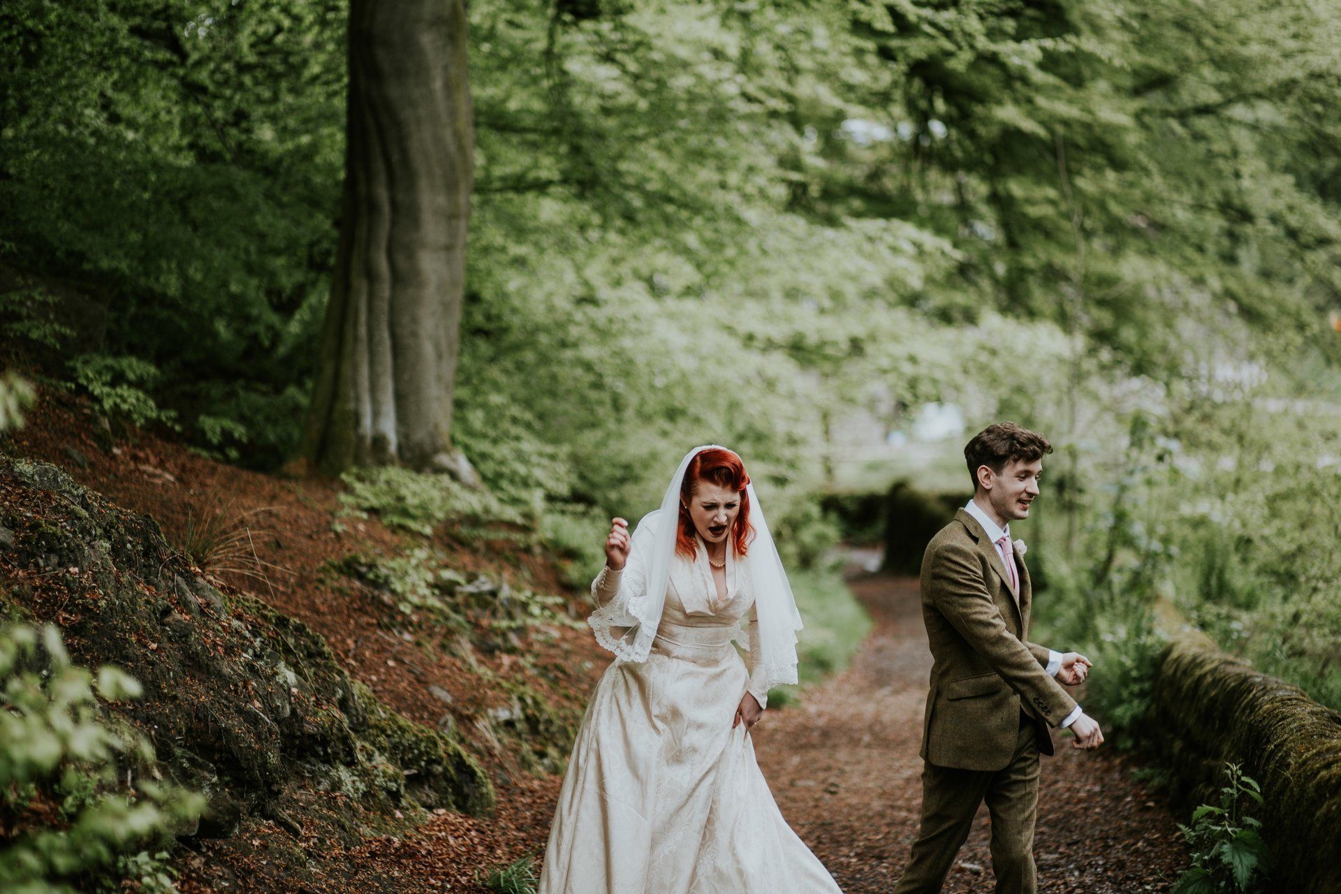 Bride and Groom dancing in forest at Gibson Mill wedding in yorkshire