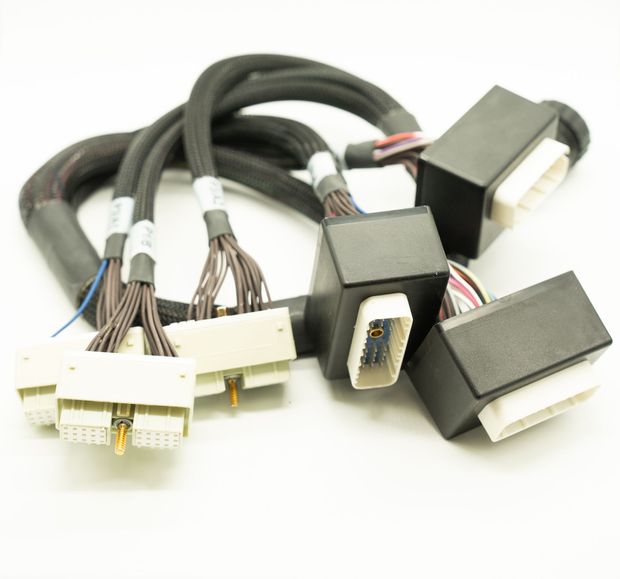 A bunch of wires and connectors on a white surface