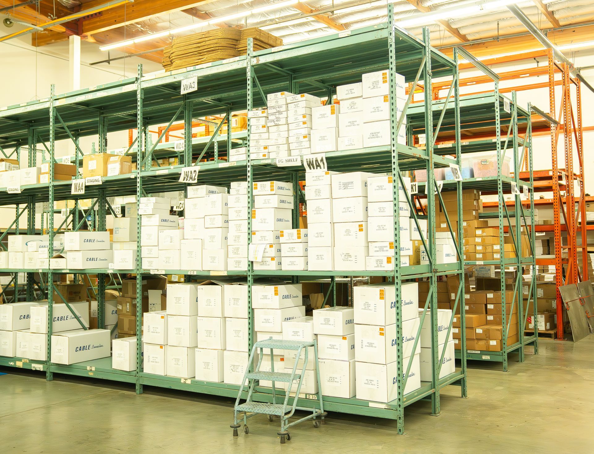 A large warehouse filled with lots of boxes and shelves.