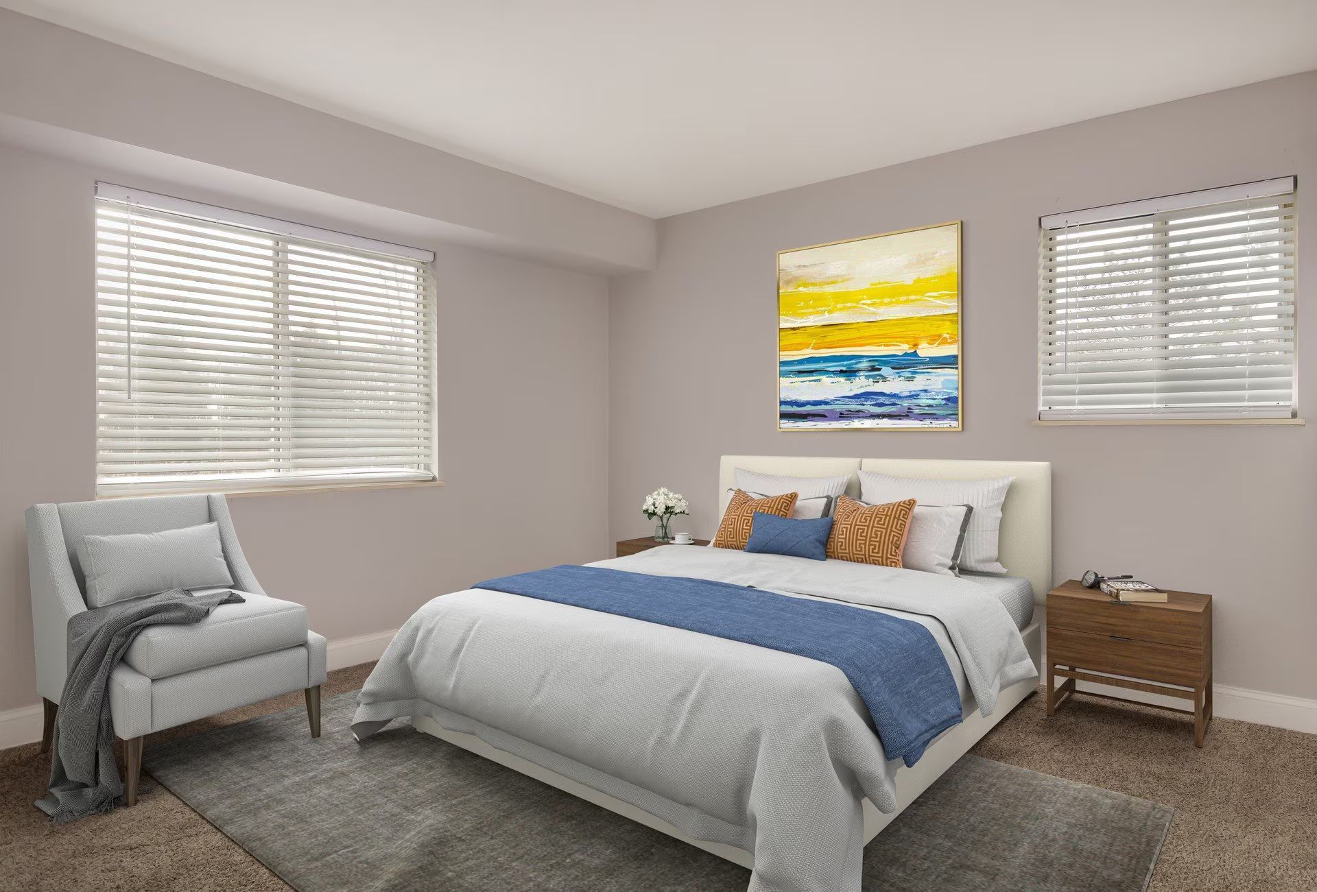 Bedroom with a bed, chair, artwork, and two windows with blinds; neutral color palette.