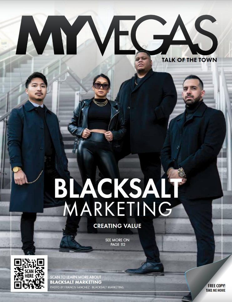 a group of people standing next to each other on the cover of a las vegas magazine