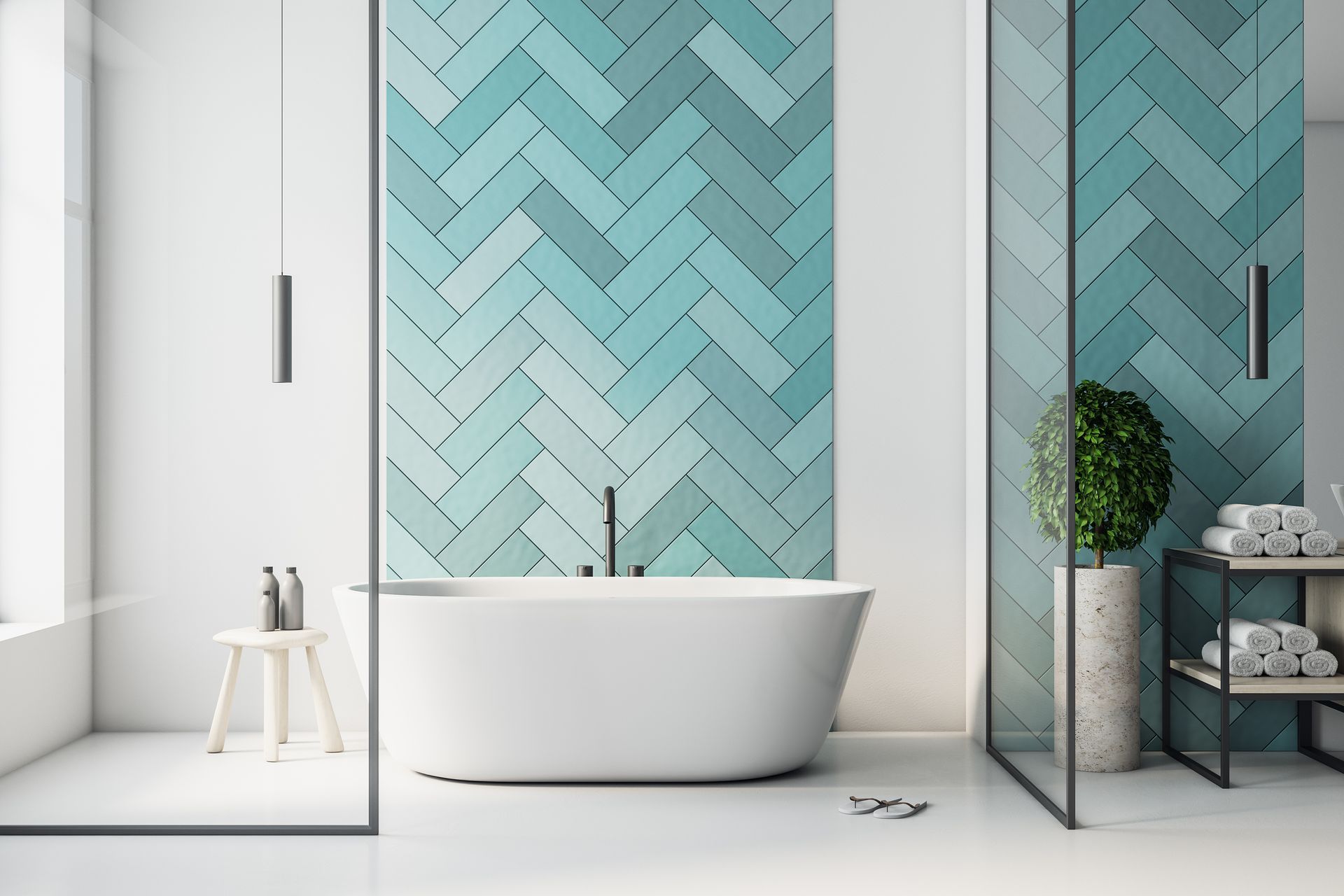Modern bathroom with freestanding tub, turquoise herringbone tile, glass shower, and vanity shelf