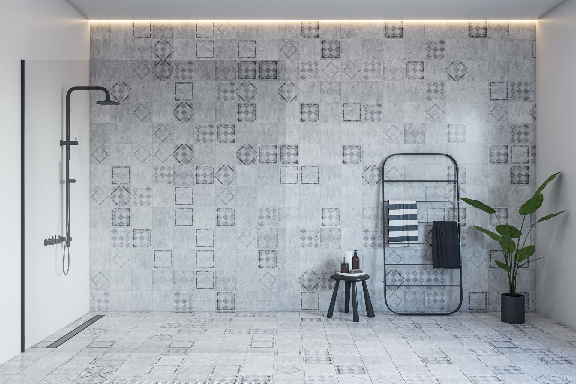 Modern gray-tiled bathroom with a shower, ladder towel rack, stool, and potted plant.
