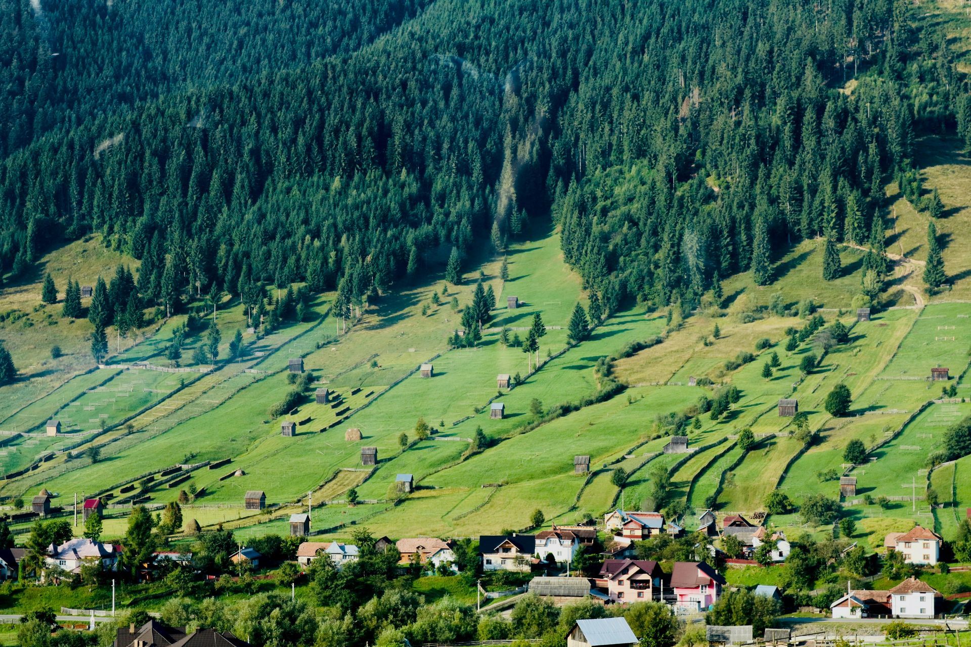 An aerial view of a small village in the mountains