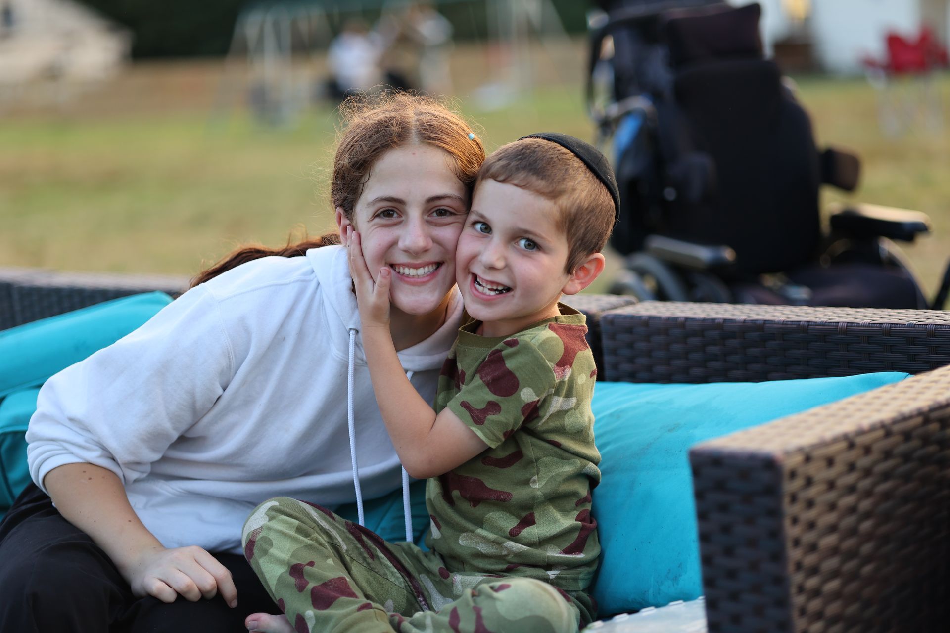 A woman and a young boy are sitting on a couch.