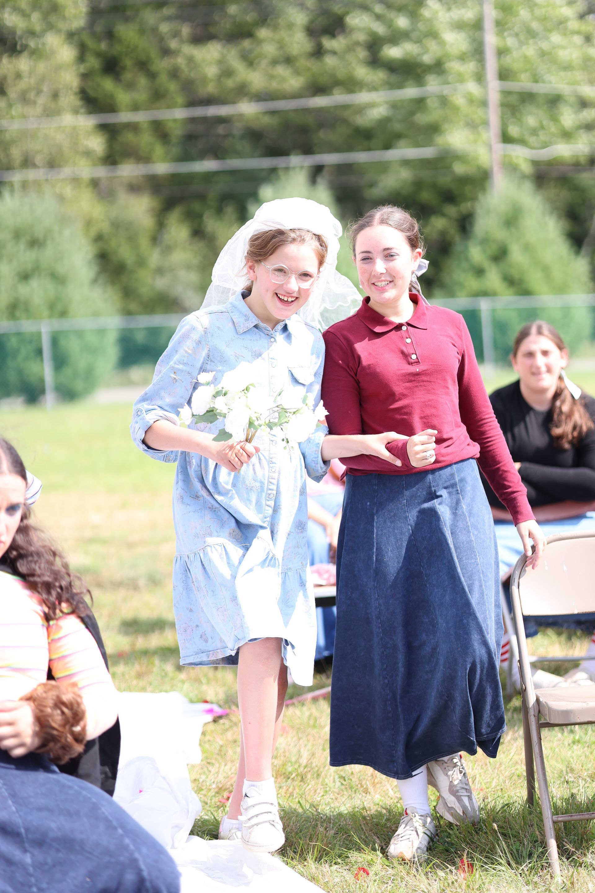 Two girls are standing next to each other.