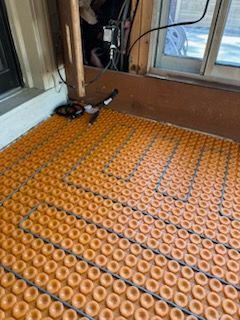 A close up of a floor with a pattern of donuts on it.