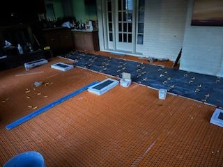 A room with a lot of boxes on the floor.