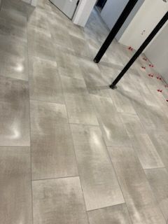 A close up of a tiled floor in a room.