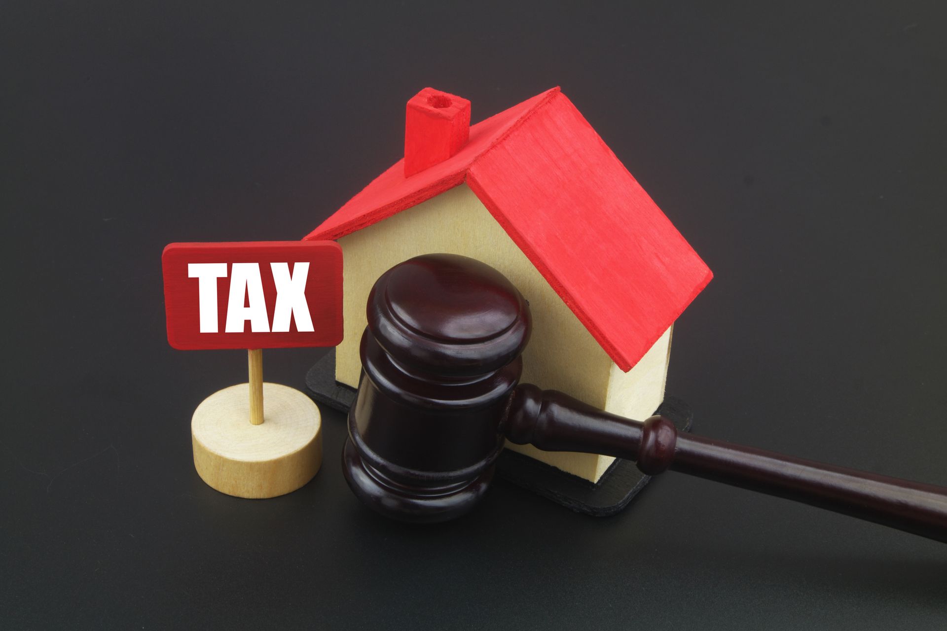Wooden gavel with house and banner with word TAX | Residential Property Tax Attorney | P&L P.C