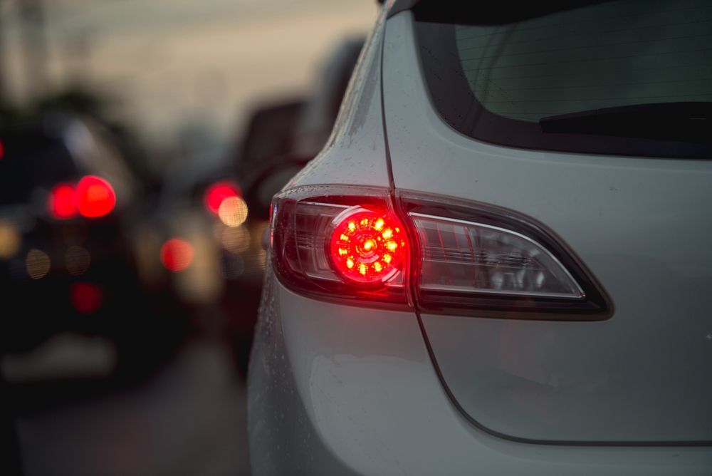 White Car's Brake Light Illuminated Red in Traffic — Elite Fleet Auto in Bowen, QLD