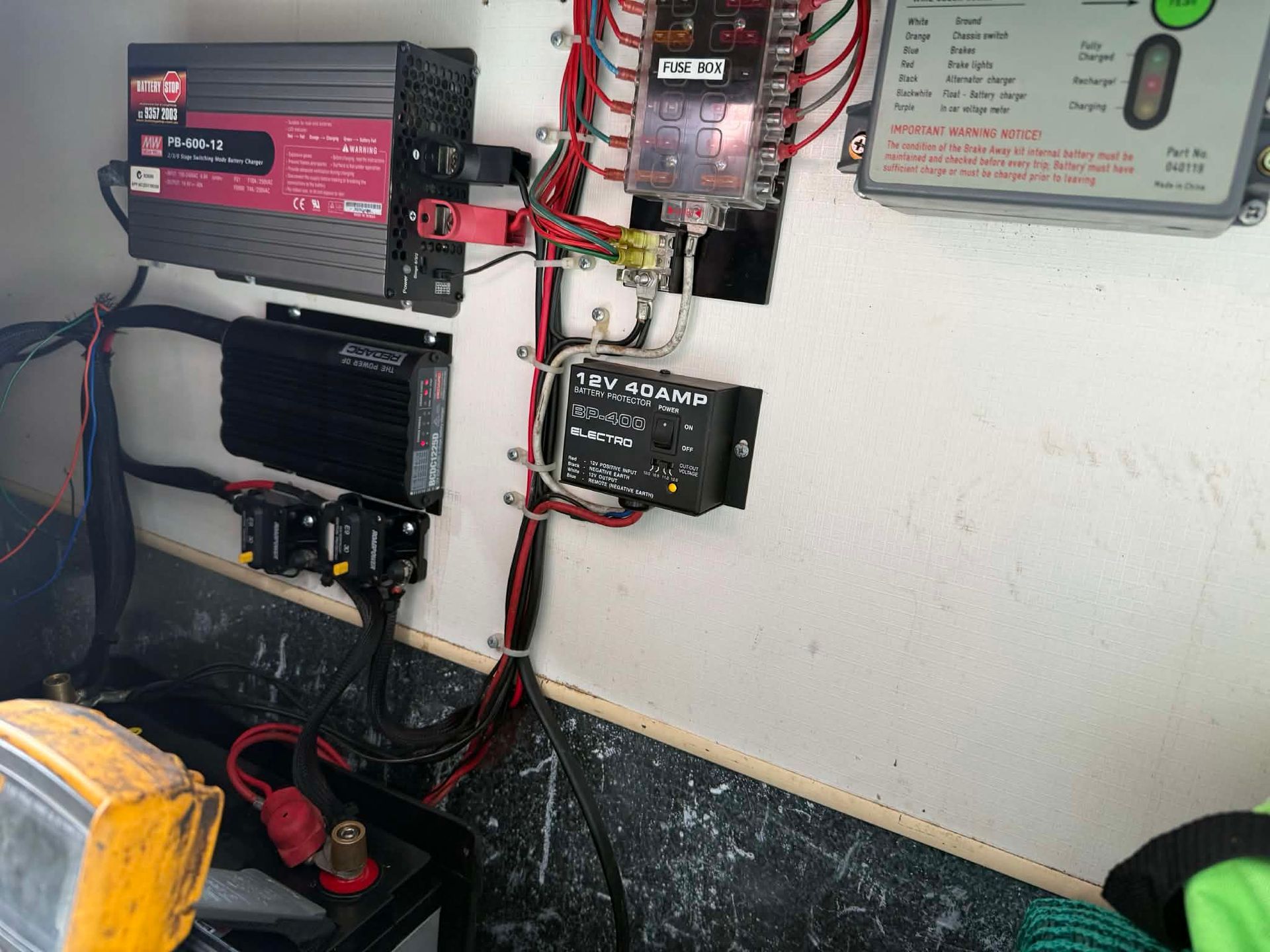 A Wall-mounted Electrical Setup Featuring An Inverter — Elite Fleet Auto in Cannonvale, QLD