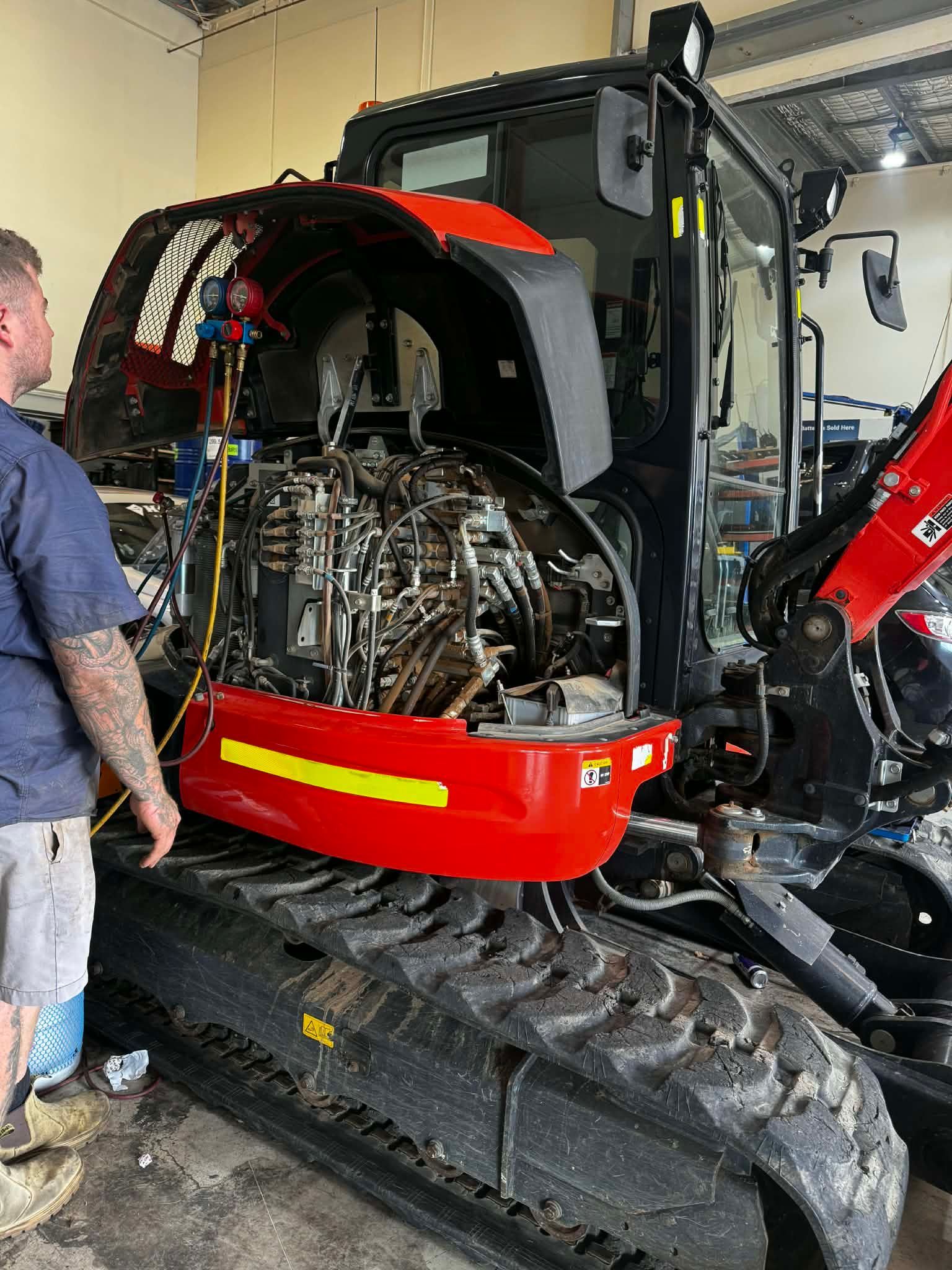 A Technician Inspects The Open Engine Compartment — Elite Fleet Auto in Cannonvale, QLD