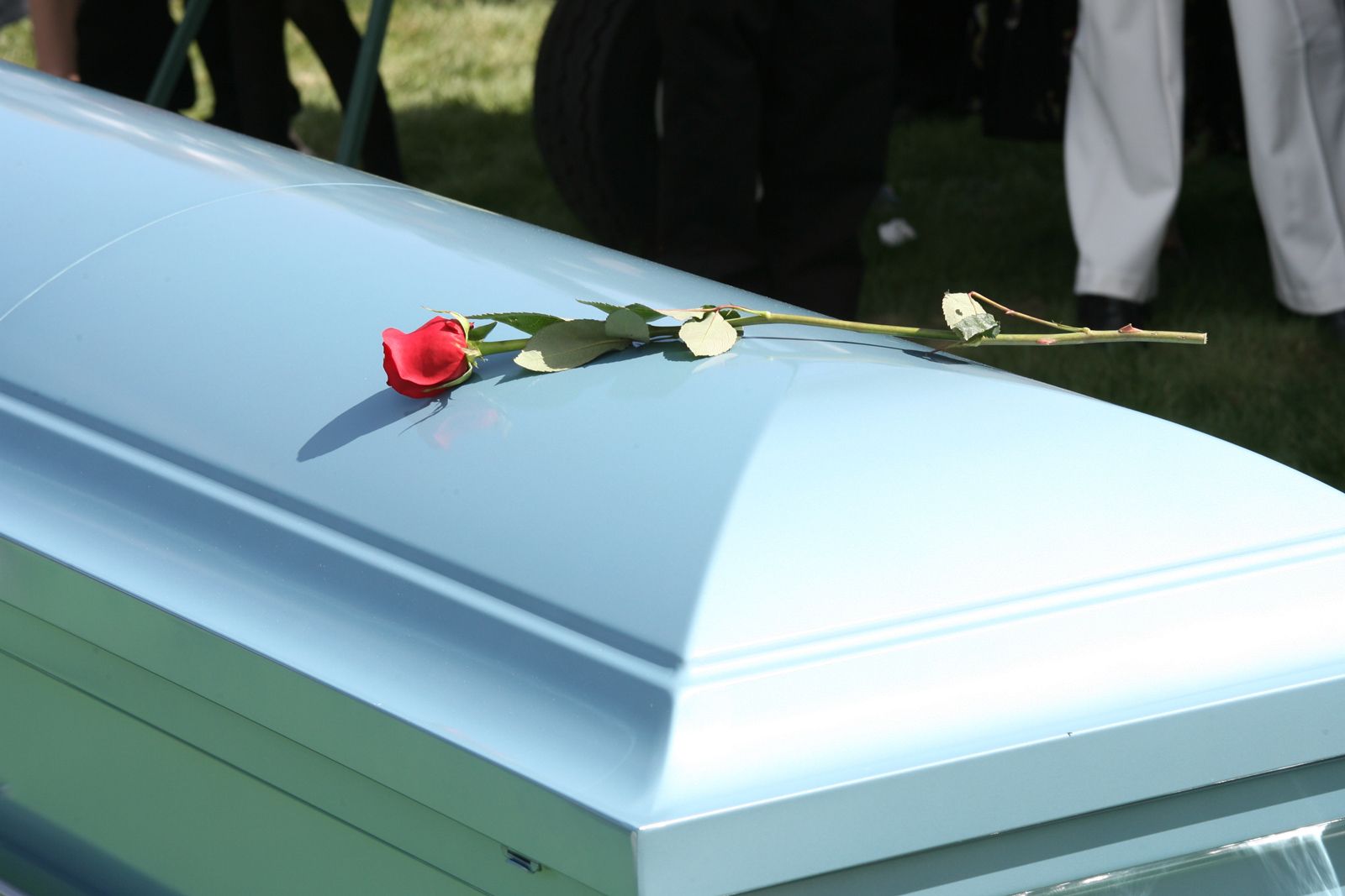 Casket With A Single Red Rose — Gallup, NM — Silver Creek Mortuary LLC