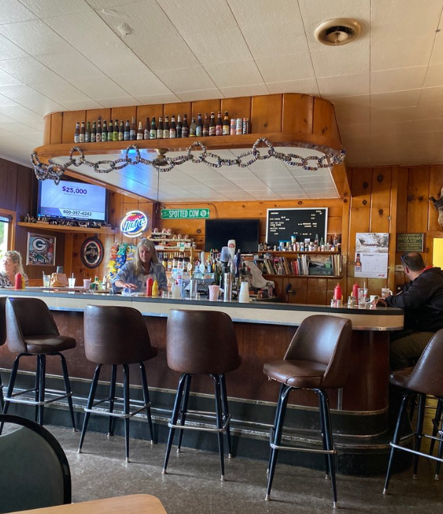 A restaurant with a pepsi sign above the bar