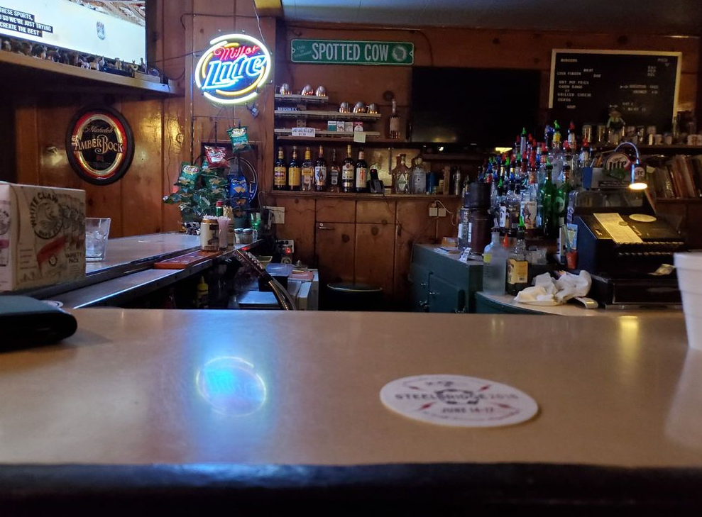 A bar with a sign that says budweiser on it