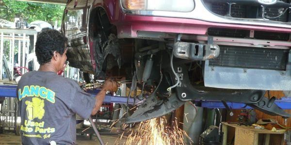 A Mechanic Reassembling Car Parts — Lawrenceville, GA — Lance Used Auto Parts