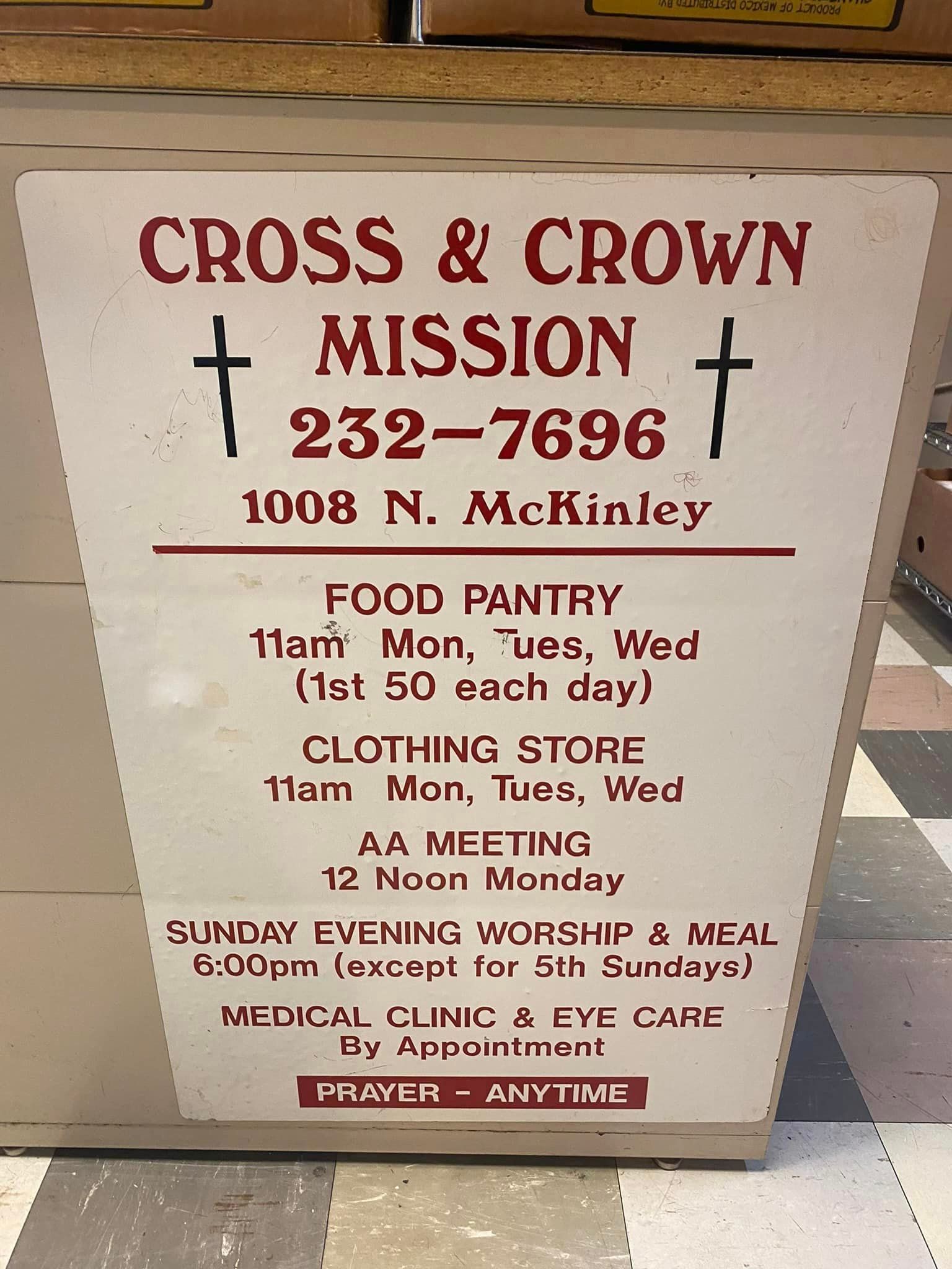 A sign that says cross & crown mission on it