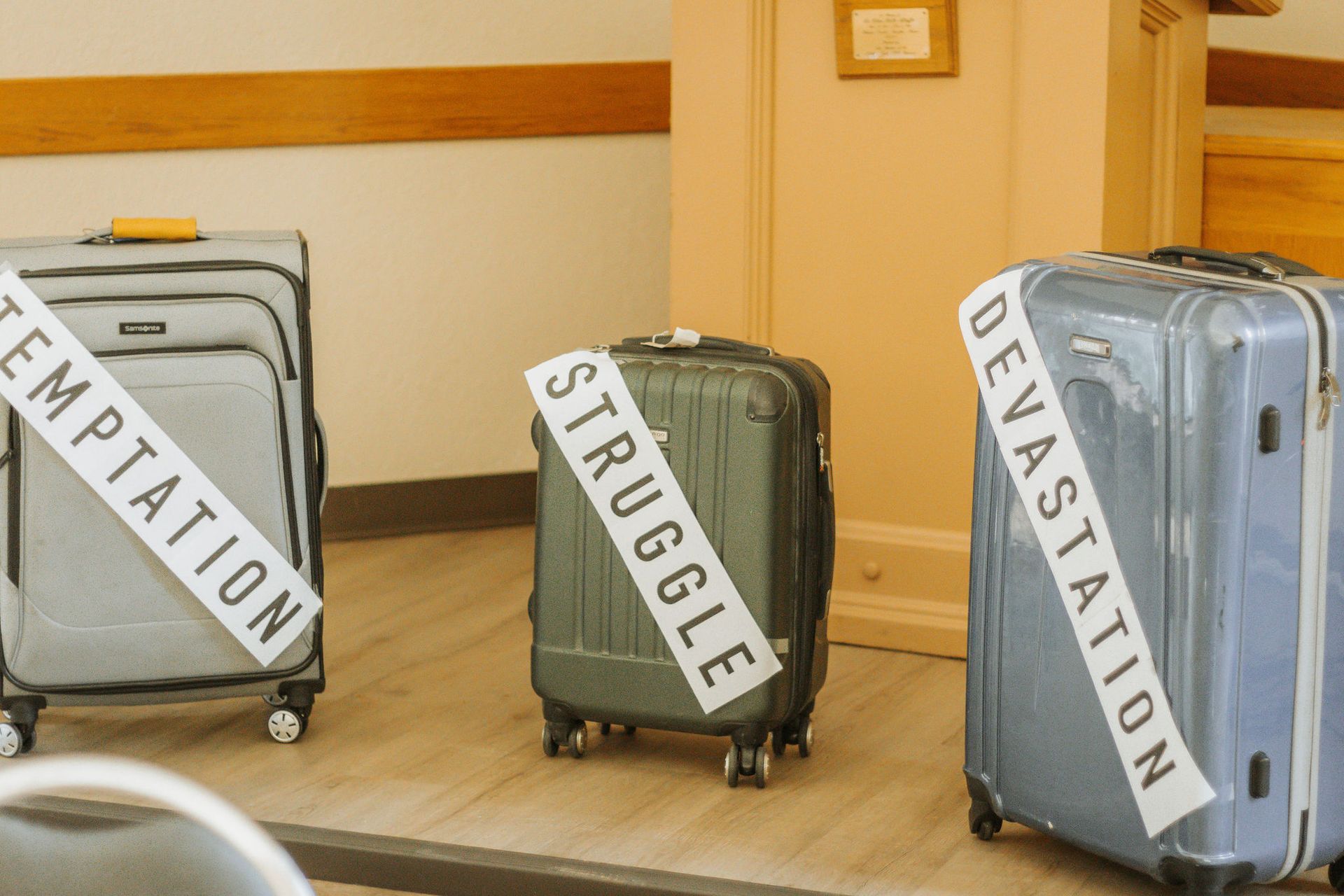 Three suitcases labeled 