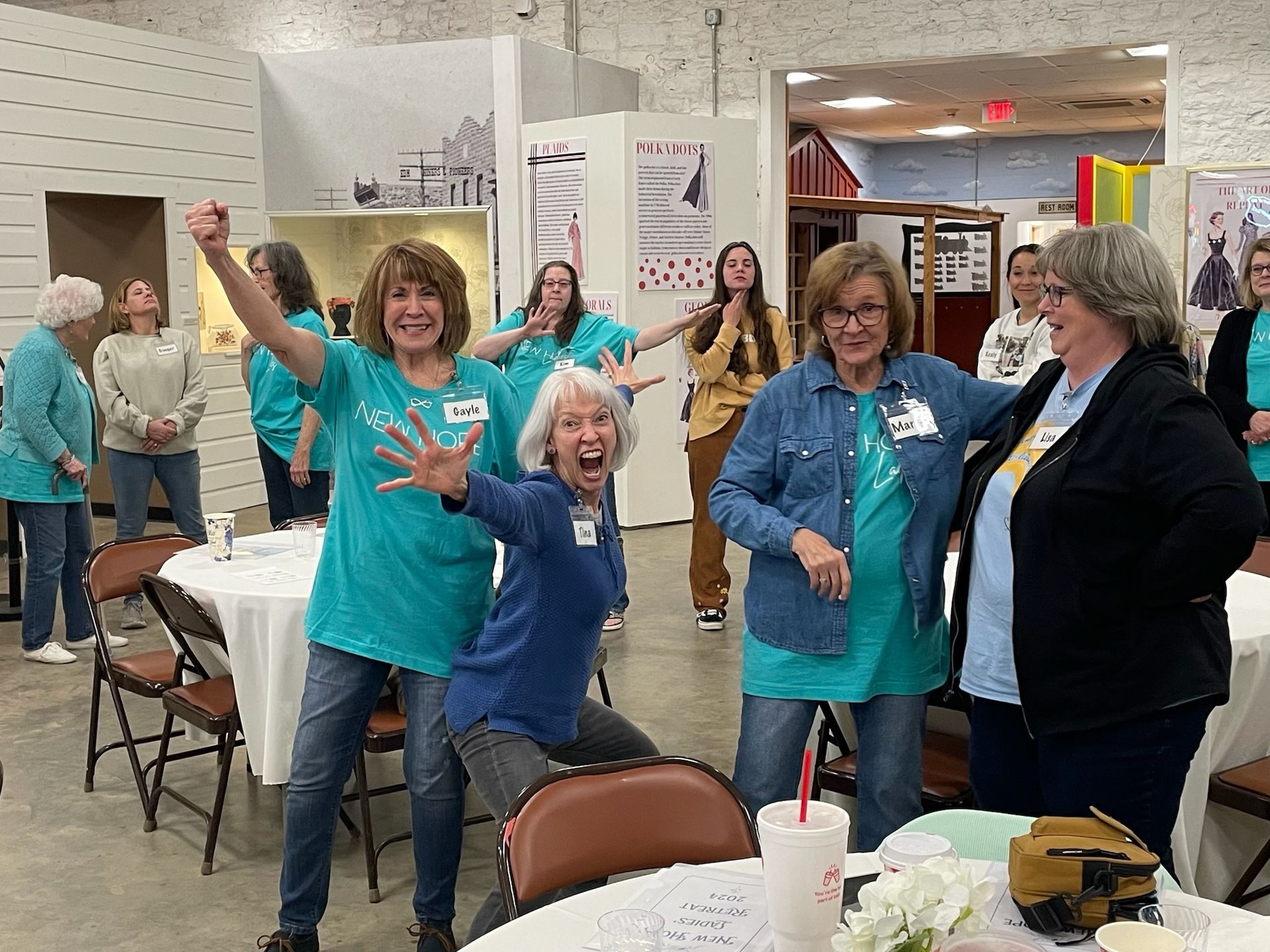 A group of women are dancing together in a room.