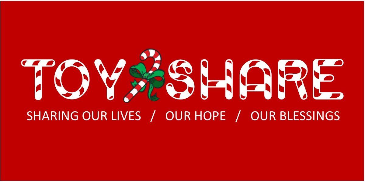 A red sign that says toy share sharing our lives / our hope / our blessings.