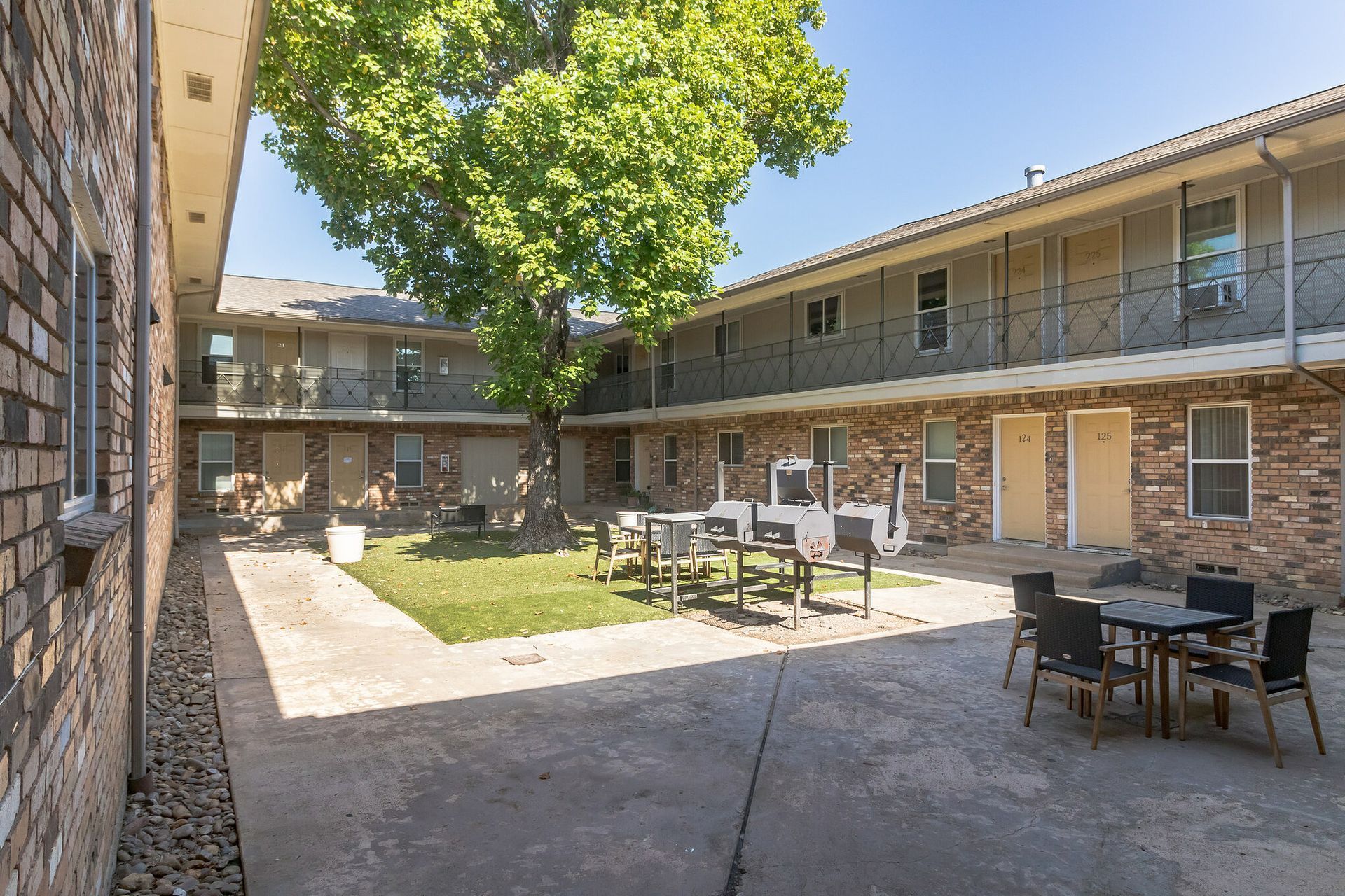 Photo of a courtyard surrounded by a two-story building
