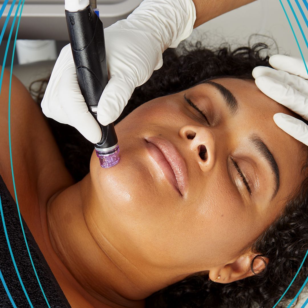 Woman receiving facial treatment with gloved hands and a handheld device.