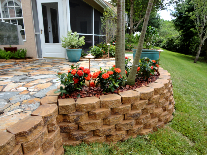 Eden Nursery | Clearwater, FL | Landscaping cement Retention, Rip-Rap Wall and Flowers, Trees, Plants, Stone Walkway