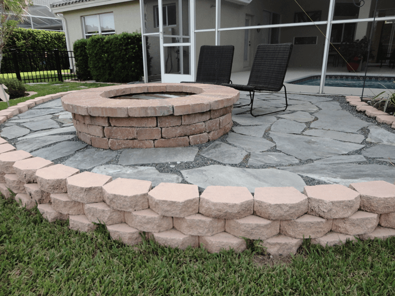 Eden Nursery | Clearwater, FL | Landscaping cement Retention, Rip-Rap Wall and Fire Pit with Stone Walkway