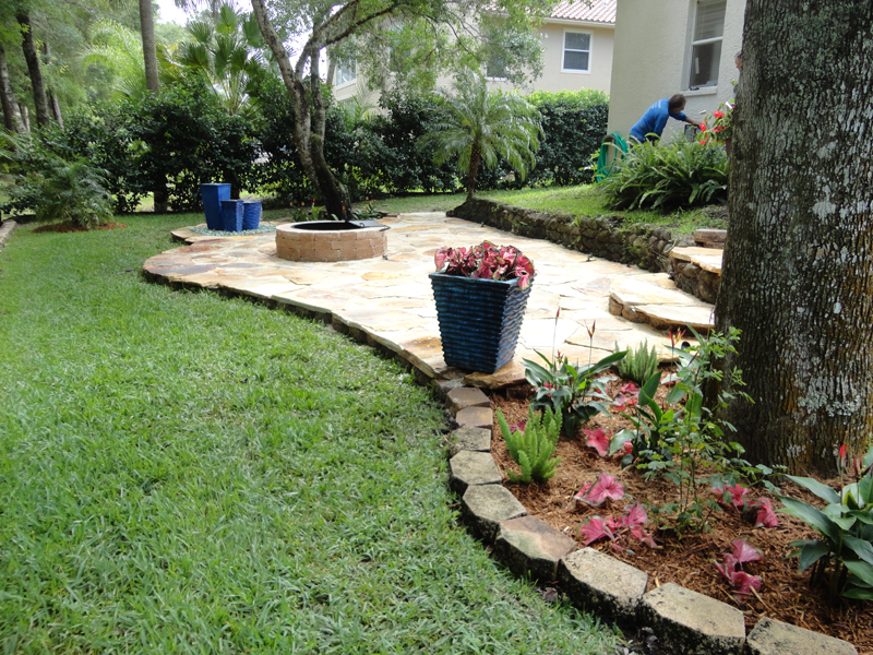 Eden Nursery | Clearwater, FL | Landscaping of Trees, Flowers, Plants, Stone Walkway and Landscapers working