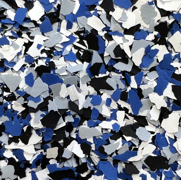 A close up of a pile of blue black and white camouflage flakes