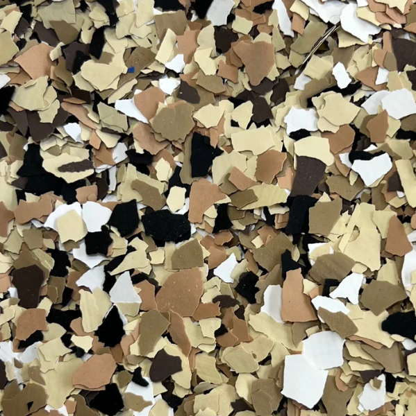 A close up of a pile of brown and white confetti