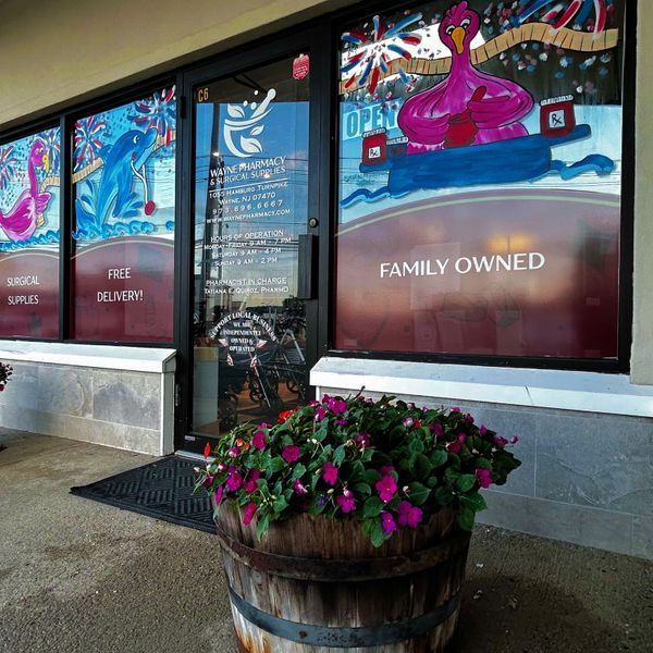 Interior view of Wharton Pharmacy with shelves, products, and a counter.