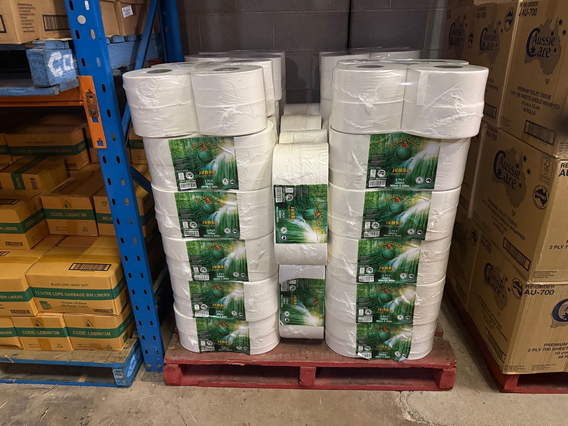 A woman is taking a piece of paper towel out of a paper towel dispenser. — Springs Cleaning Supplies In Ciccone, NT