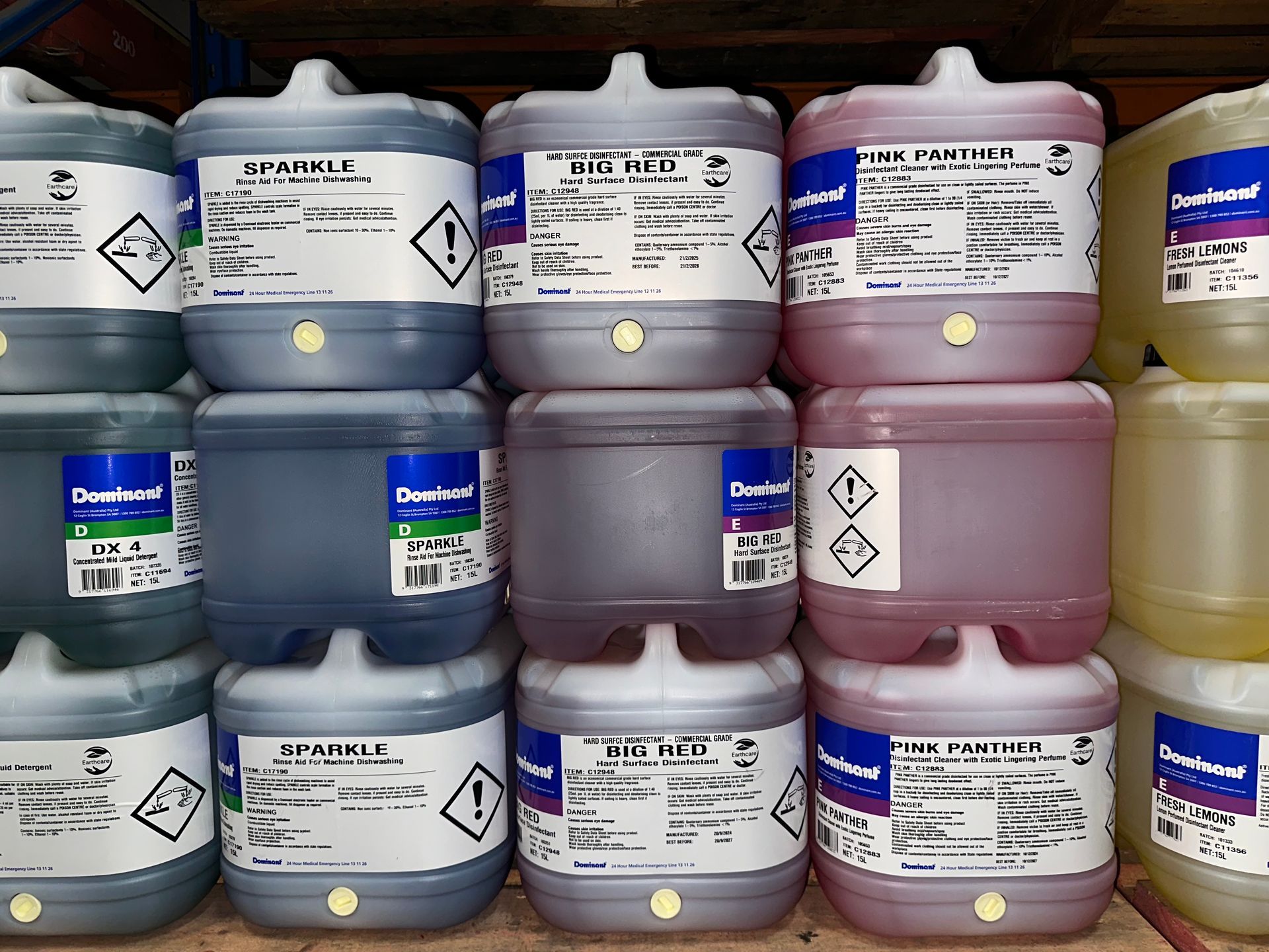 A Basket of Cleaning Supplies is Sitting on a Stove Top in a Kitchen — Springs Cleaning Supplies In Ciccone, NT