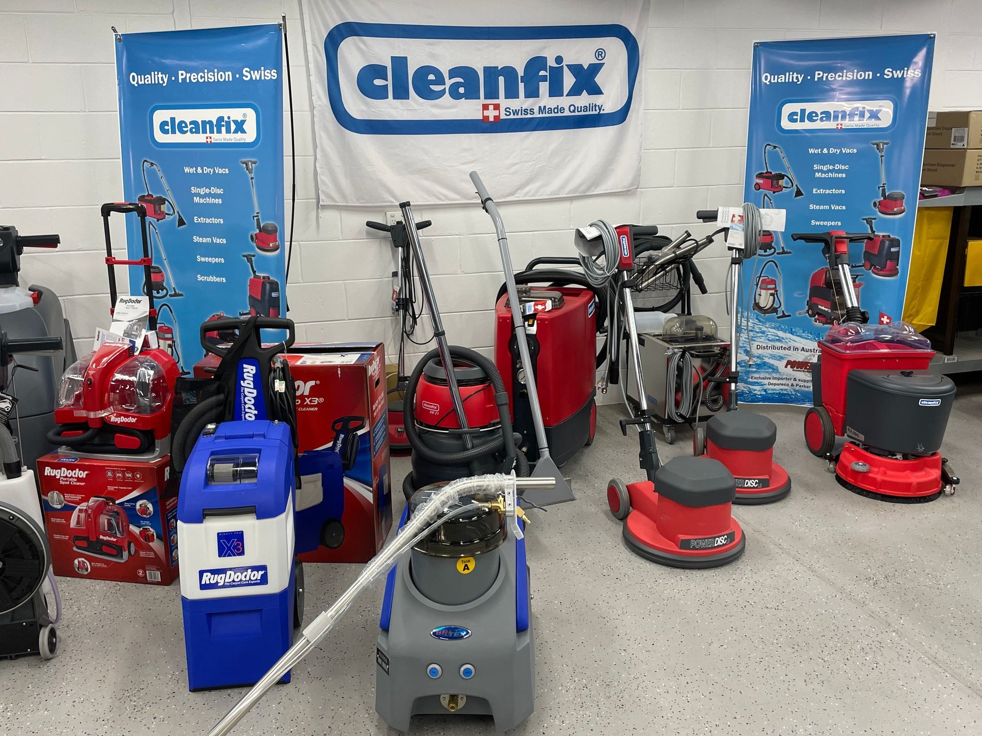 A Man Is Driving A Forklift In A Warehouse Filled With Lots Of Boxes And Barrels — Springs Cleaning Supplies In Ciccone, NT