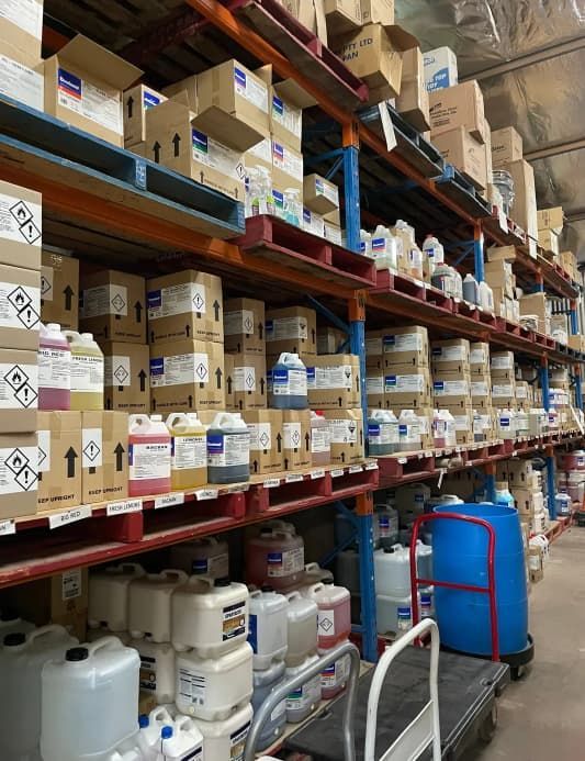 A Warehouse Filled With Lots Of Containers And Boxes — Springs Cleaning Supplies In Ciccone, NT