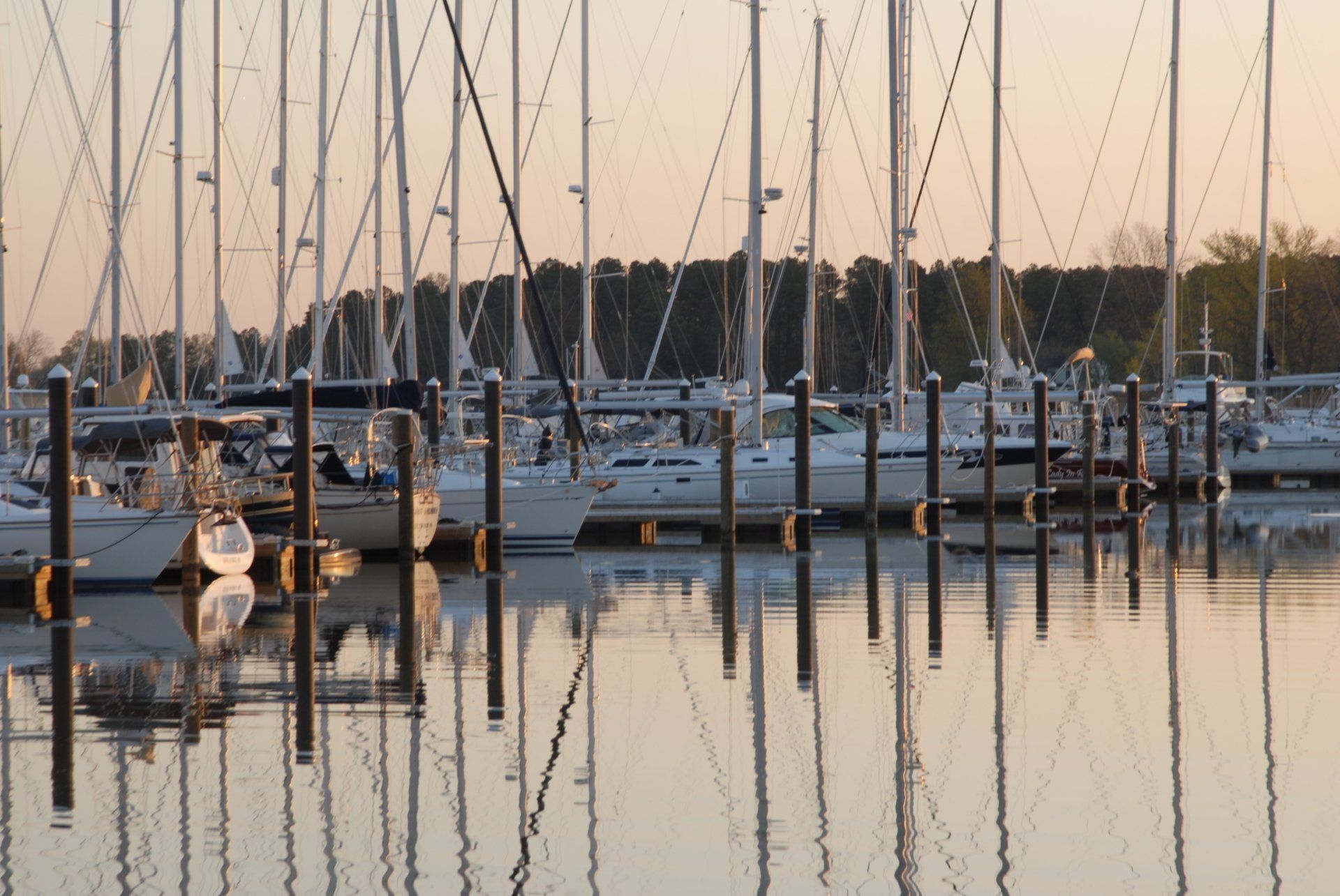 Boats at a dock during a spring sunrise