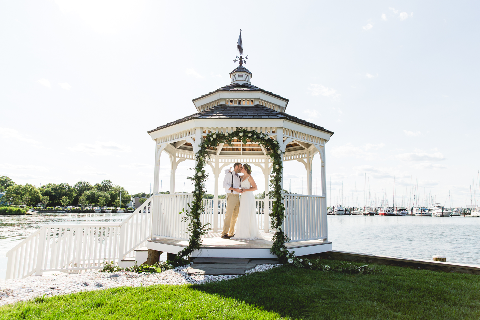 Wedding couple in a gazebo on the waterfront