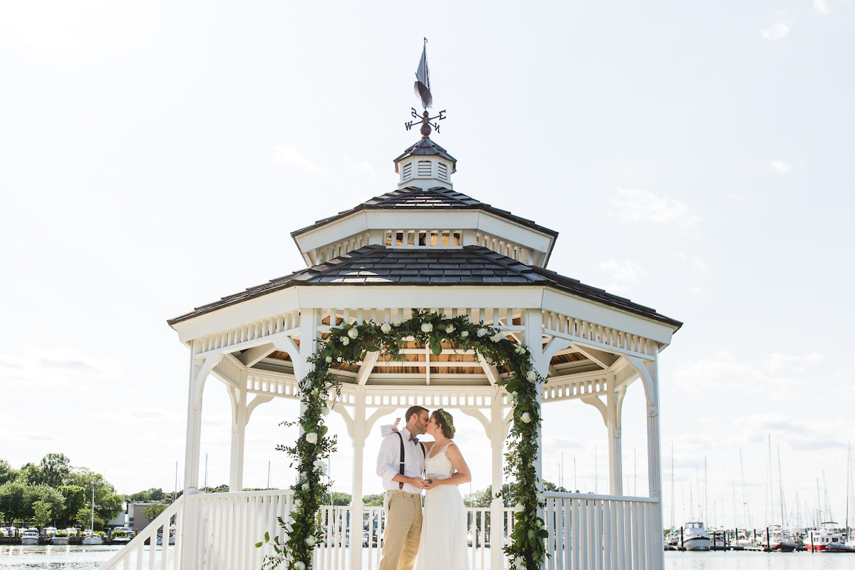 Wedding couple in a gazebo on the waterfront