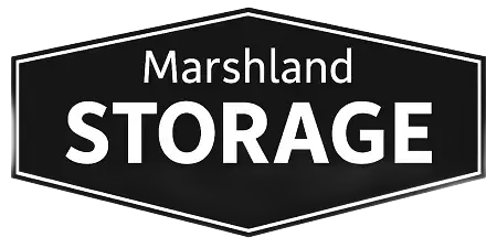 Black and white logo for Marshland Storage. Text on a dark hexagon with a white border.