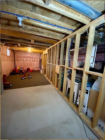 A basement with a lot of wooden frames and boxes.