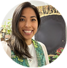 A Filipina woman with shoulder length brown hair in a white shirt and green stole.