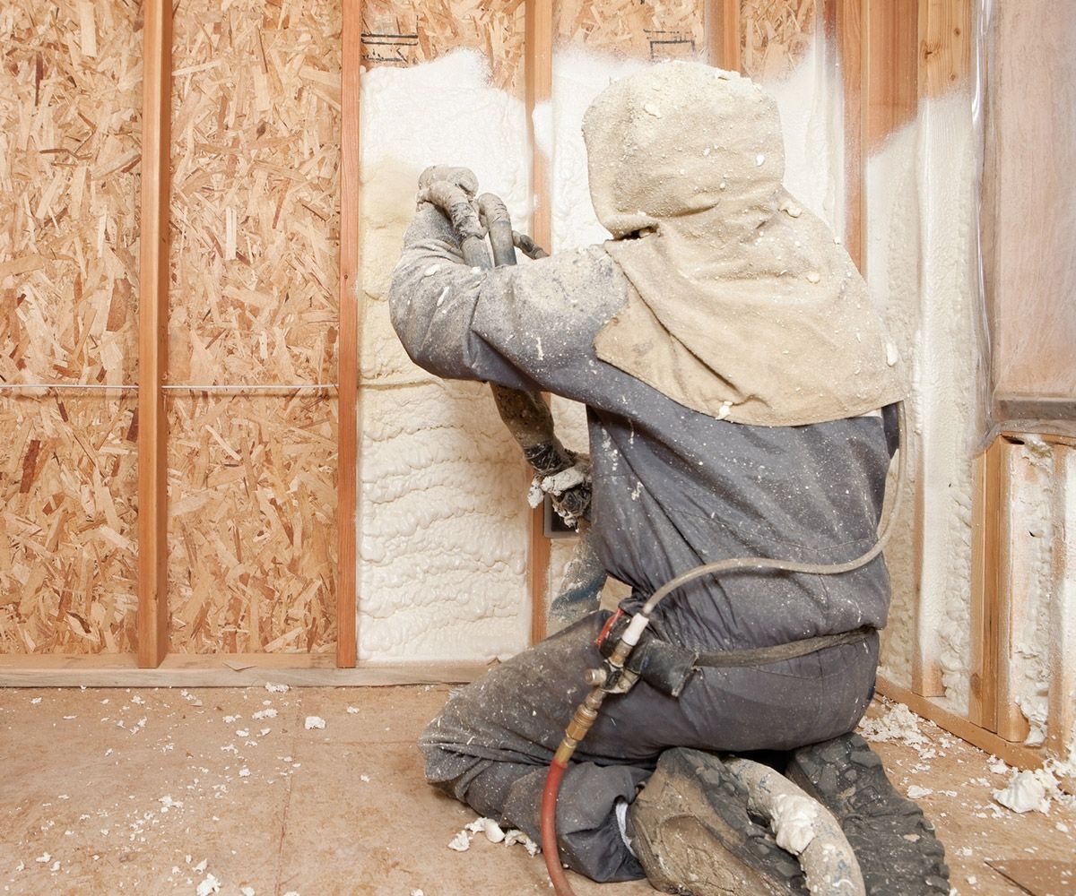Worker Spraying Expandable Foam Insulation — Horseheads, NY — Diamond Quality Insulation