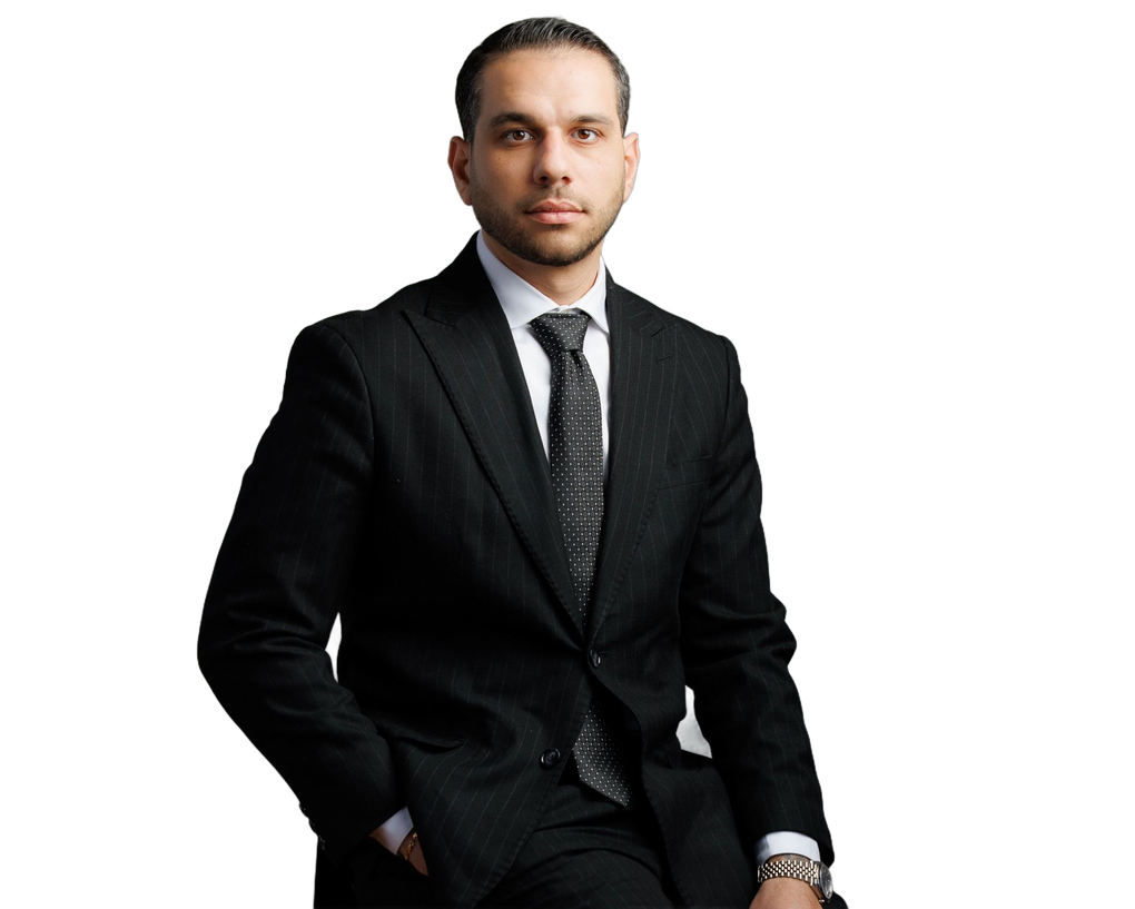 A man in a suit and tie is smiling for the camera.