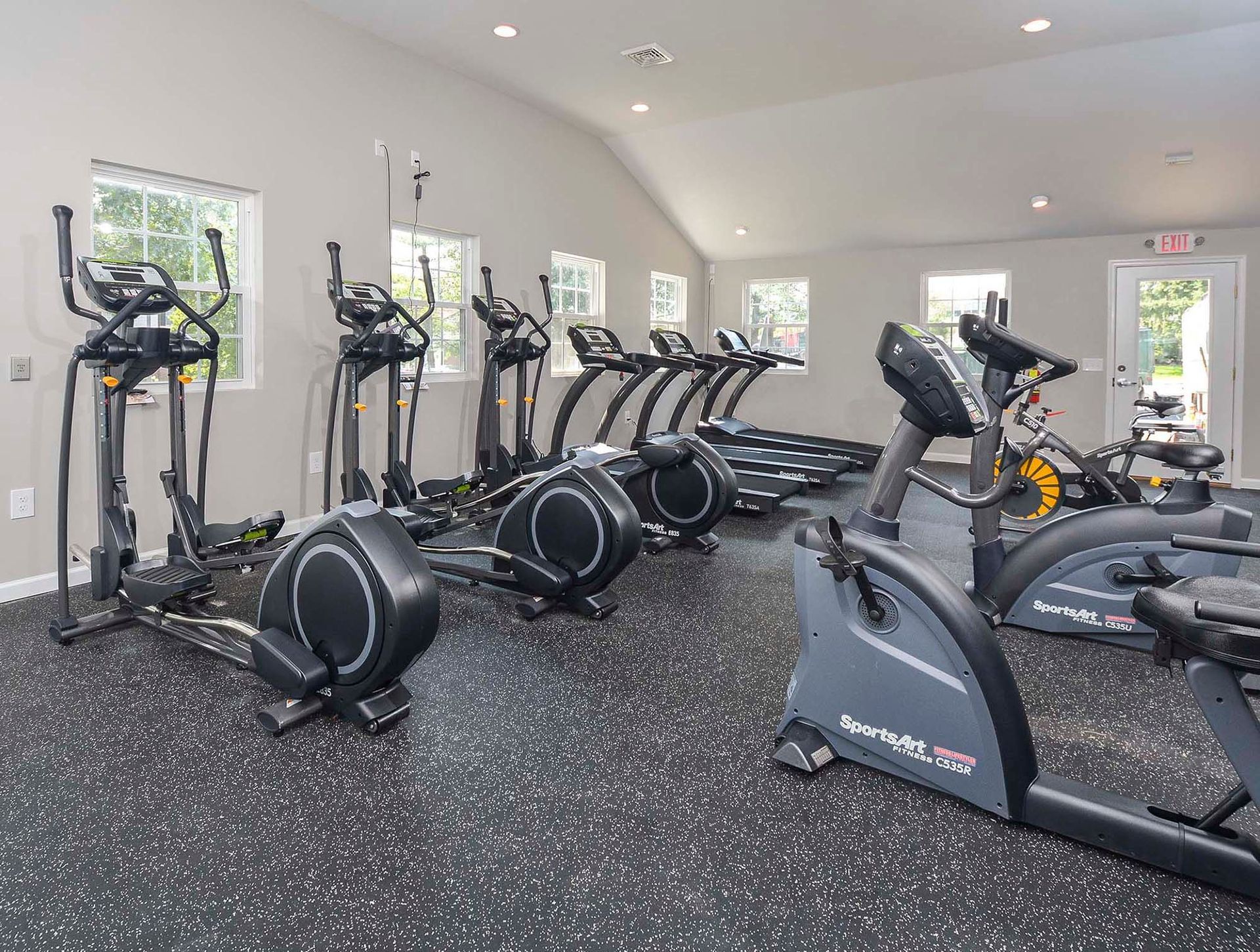 Interior view of a modern apartment community gym with treadmills, ellipticals and stationary bikes. Contact us today to learn more about our pet-friendly 1, 2, 3, and 4-bedroom apartments for rent in Bethlehem, PA. At River Pointe Townhomes, you’ll enjoy a prime location near Lehigh River and all the amenities and extras that make your life comfortable. We can’t wait to welcome you home!