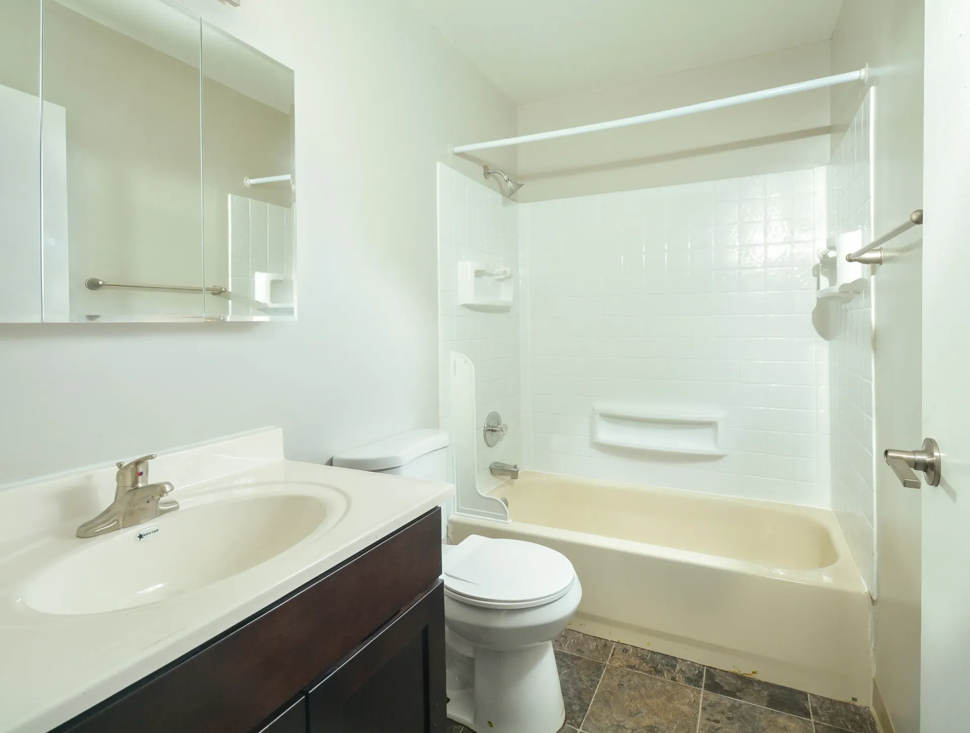 Bathroom in an apartment with vanity, mirror cabinet, toilet, and tub/shower. Contact us today to learn more about our pet-friendly 1, 2, 3, and 4-bedroom apartments for rent in Bethlehem, PA. At River Pointe Townhomes, you’ll enjoy a prime location near Lehigh River and all the amenities and extras that make your life comfortable. We can’t wait to welcome you home!